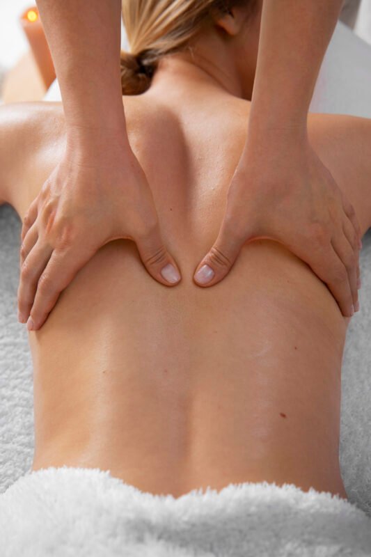woman-getting-back-massage-from-masseur (2)